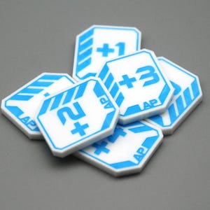 May include: A collection of white octagonal game tokens featuring blue printed graphics. Each token displays a numerical value with a plus sign, such as +1, +2, or +3, alongside the letters AP. The tokens have a blue border and striped accents.