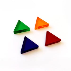 May include: Four triangular game pieces in different colours: green, orange, red, and blue.