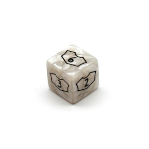 May include: A single, six-sided die with a pearlescent, marbled appearance. The die features black outlined numbers 2, 3, and 6 on its faces. The die is set against a plain white background, highlighting its design.