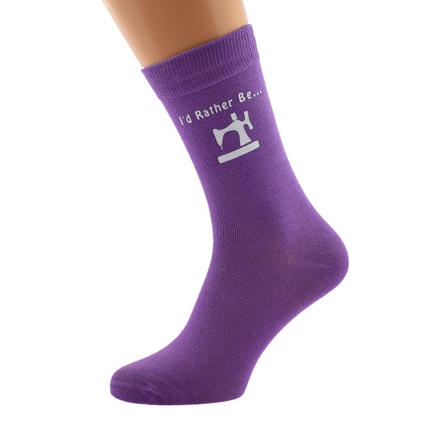 I'd Rather Be Sewing with Sewing Machine Image Printed in White Vinyl on Ladies Purple Cotton Blend Socks.  Size UK one size 8-12