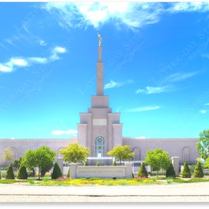 May include: A white temple with a tall spire and a golden statue on top. The temple is surrounded by a green lawn and a black fence. The sky is blue with white clouds.