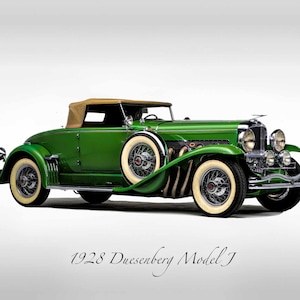 May include: A green 1928 Duesenberg Model J convertible car with a tan top. The car has chrome accents and wire wheels.