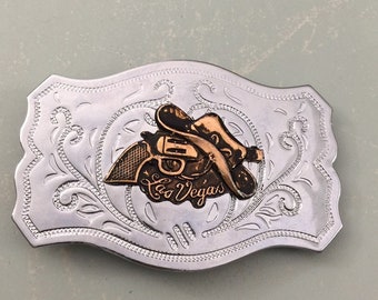 Vintage Las Vegas Belt Buckle with Copper Cowboy Hat and Revolver on a Silver Tone Background