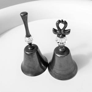 Set of two Silver Dinner Bells with  Crystal Section in the Handle - two swans or ducks kissing at the top