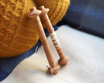 Handturned spools for threads, from medieval to nowadays, pair