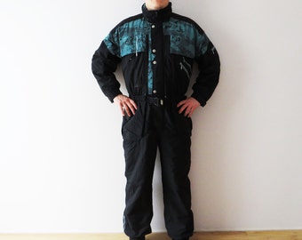 Vintage zwart eendelig skipak: retro snowboardjumpsuit (XL)
