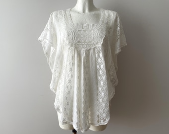 Ivoorkleurige kanten blouse: vintage doorzichtige mouwloze top