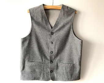 Chaleco vintage gris a cuadros: Chaqueta sin mangas de franela a cuadros, talla grande.