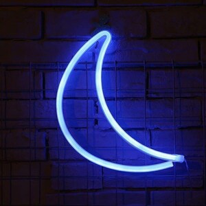 May include: A blue neon crescent moon light fixture on a brick wall.