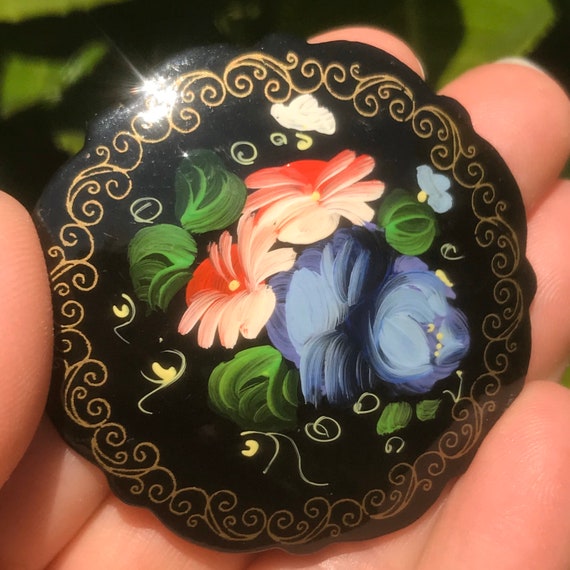 Hand outlet painted brooches