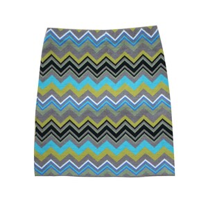May include: A gray, blue, black, and yellow chevron patterned skirt.