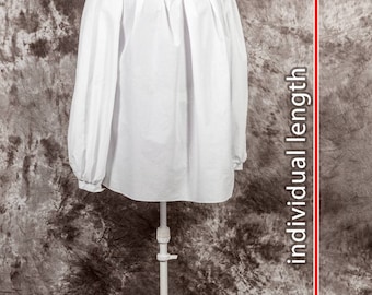 May include: White peasant blouse with long sleeves and a gathered neckline. The blouse is displayed on a white mannequin and is shown from the front. The blouse is approximately 69 cm long.