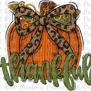 May include: An orange pumpkin illustration with a leopard print bow and the word "thankful" in green script. The pumpkin has a brown stem and green leaves. A fall-themed design.