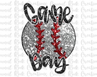 May include: A silver glitter baseball with red stitching and the words "Game Day" in black glitter lettering.