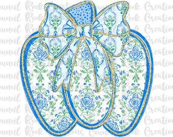 May include: A decorative pumpkin design with a blue and white floral pattern and a gold glitter outline. The pumpkin has a large bow at the top with a polka dot pattern. The design is perfect for fall decor.