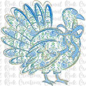 May include: A whimsical turkey illustration with a floral pattern in shades of blue, green, and white, accented with gold glitter. The turkey has a blue bow and is suitable for Thanksgiving or fall-themed crafts.