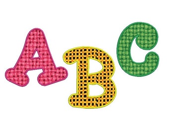 May include: ABC letters in a colourful, woven pattern. The letter A is pink, the letter B is yellow and orange, and the letter C is green.