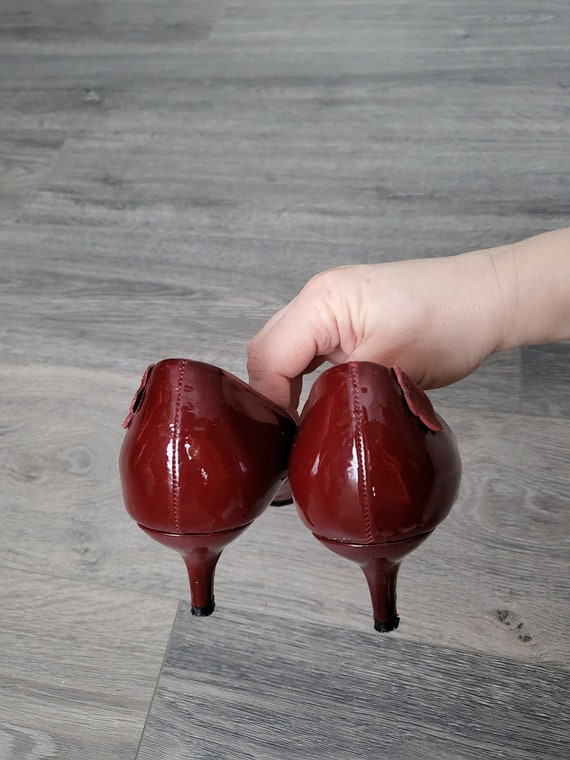 carmela patent leather bow & tassel red sole pumps