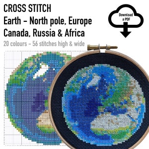 May include: A cross stitch pattern of Earth featuring the North Pole, Europe, Canada, Russia, and Africa. The design uses 20 colors and is 56 stitches high and wide. The image includes a wooden embroidery hoop containing the finished stitched globe.