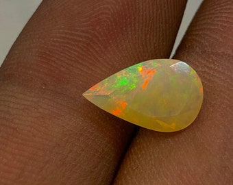 High Grade Quality Ethiopian Opal, Natural Amazing Full Fire Flashy Pear Shape Faceted Cut Stone For Making Jewelry, 7.5x12 MM 1.50 Carat.