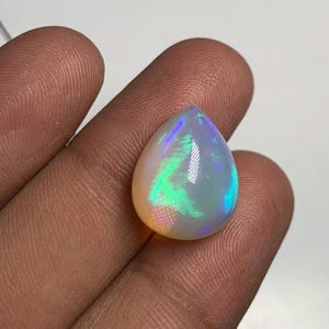 New Arrival Extraordinary Rare Top Quality Opal Stunning Flash Fire Pear Shape Natural Designer Collection For Sale  13x16 mm  height 10 mm