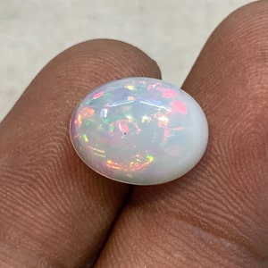 Ultieme multi-fire Ethiopische opaal edelsteen, gladde gepolijste ovale cabochon losse steen, afmeting 10 x 13 mm, gewicht 3,85 kt, hanger maken.