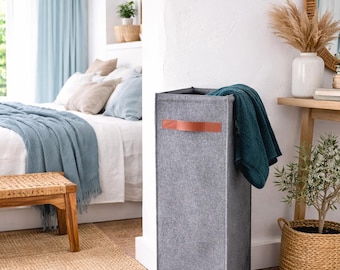 Slim tall laundry hamper designed to fit narrow spaces and small apartments