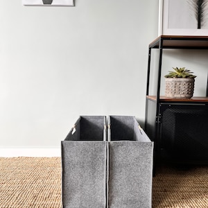 High and extra narrow basket with two long compartments. Storage hamper with lid