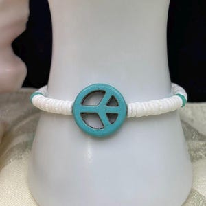 Groovy Casual Summery Bohemian Unisex Cord Bracelet - Aqua Blue Resin Peace Sign, White Shell Puka Beads, Turquoise Crystals, Adj 6.5-8 inch