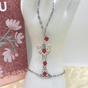 Silver Filigree Heart Hand Chain: Hypoallergenic Paperclip Chain, Deep Ruby Red Faceted Crystals, Lobster Clasp, Adjustable