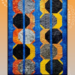 May include: A quilt pattern called "Eclipses" by Creative Sewlutions for Villa Rosa Designs. The quilt features a geometric design of octagons in shades of orange, yellow, gray, and black on a blue background.