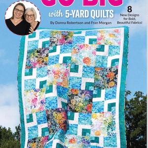 May include: A quilt pattern book titled Go Big with 5-Yard Quilts by Donna Robertson and Fran Morgan. The cover features a colorful patchwork quilt with blue, white, and floral fabric squares, and a small circular photo of the two authors.