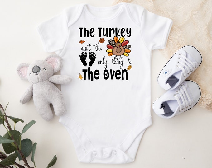 Turkey Ain't The Only Thing In The Oven Baby Bodysuit