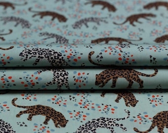 Batiste cotton fabric printed cheetahs on the light green background, by 50 cm