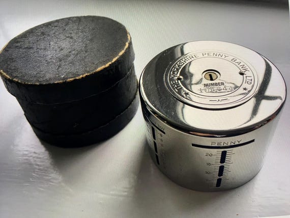 Vintage The YORKSHIRE PENNY BANK round chrome home safe money box - in original box - 1920s