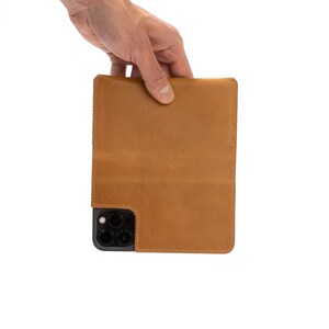 leather folio case with strong magsafe magnet attachment for iphone 14 series made by geometric goods from premium italian leather in europe offer free shipping to usa