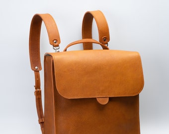 Leather backpack handcrafted from eco friendly Italian vegetable tanned leather & durable cotton lining, closes on secure magnetic closure