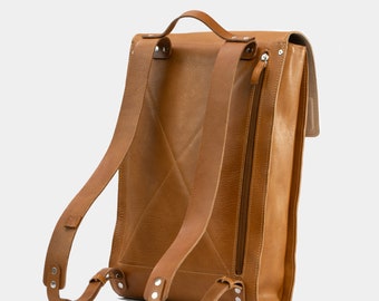 Leather backpack with padded laptop compartment, and hidden AirTag pocket, handcrafted from Italian vegetable tanned leather