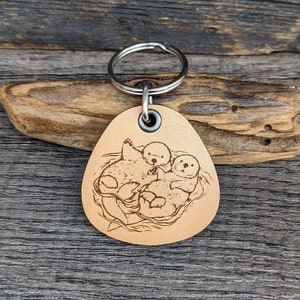Playful Otters - genuine leather keychain