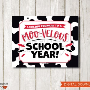 May include: A printable sign with a black and white cow print background. The sign says "Looking forward to a Moo-velous School Year!" in red and black text.