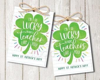 May include: Printable gift tags featuring a green shamrock with the text "I'm so lucky to have a teacher like you!" and "Happy St. Patrick's Day!" on a white background with blue lines.