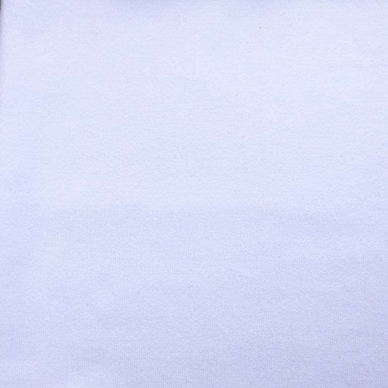 May include: A plain white fabric background.