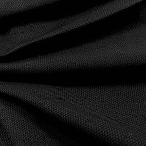 May include: Black fabric with a textured weave. The fabric is folded and draped, showing the texture and drape of the material.