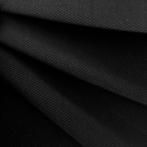 May include: Black fabric with a textured surface and a subtle sheen. The fabric is folded in a way that creates a series of diagonal lines.