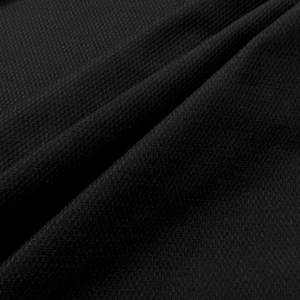 May include: Black textured fabric with a subtle waffle weave pattern. The fabric is folded in a diagonal fold, creating a soft, draping effect.