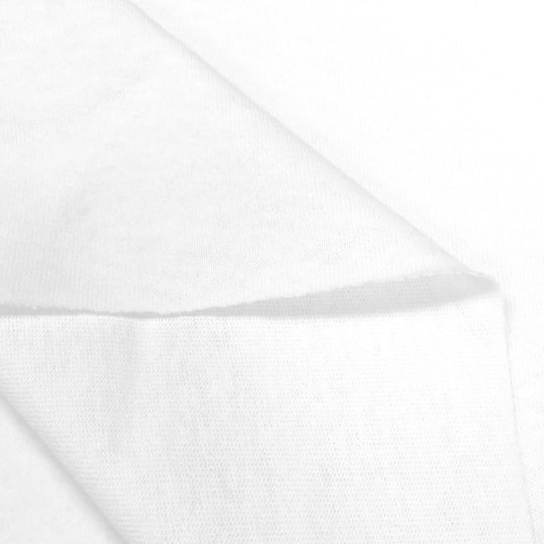 May include: White fabric with a smooth texture. The fabric is folded in half, showing the inside and outside of the material.