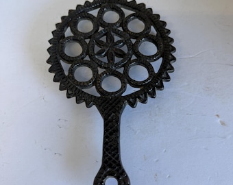 Antique Circles and Star Black Cast Iron Trivet
