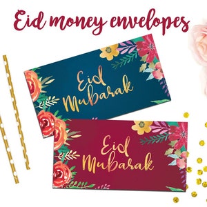 Puede incluir: Dos sobres de dinero con estampado floral y letras doradas que dicen "Eid Mubarak". Un sobre es azul marino y el otro es burdeos.