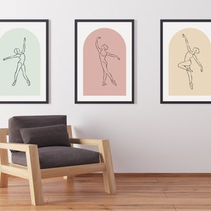 May include: Three framed prints of a line drawing of a ballerina in a variety of poses. Each print has a different colored background: green, pink, and yellow.
