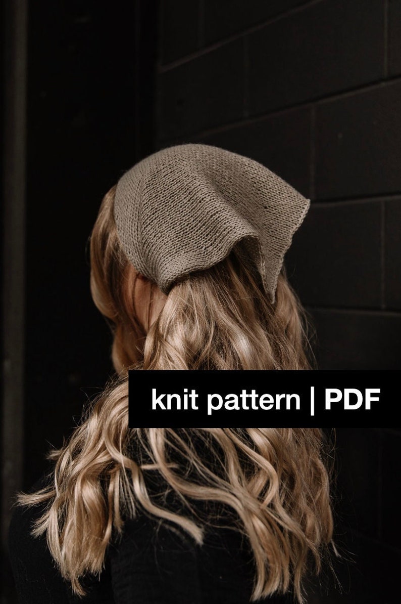 May include: A knit pattern for a simple, square-shaped scarf or bandana. The pattern is available as a PDF download. The image shows a woman wearing the finished scarf, which is a light brown color.
